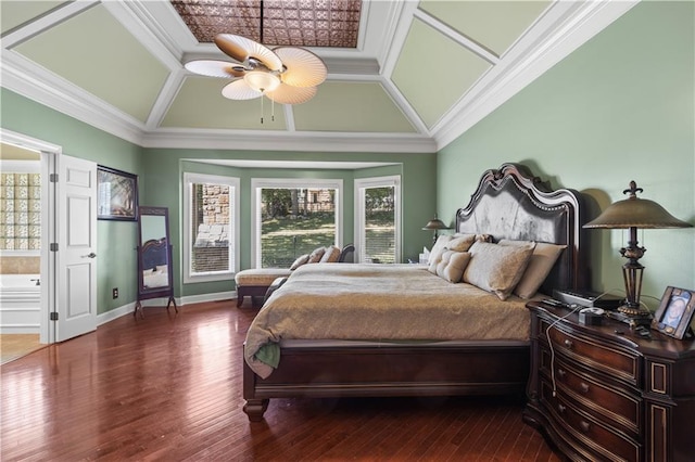 bedroom featuring coffered ceiling, hardwood / wood-style floors, connected bathroom, ornamental molding, and ceiling fan