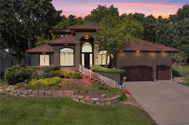 mediterranean / spanish-style house featuring a lawn