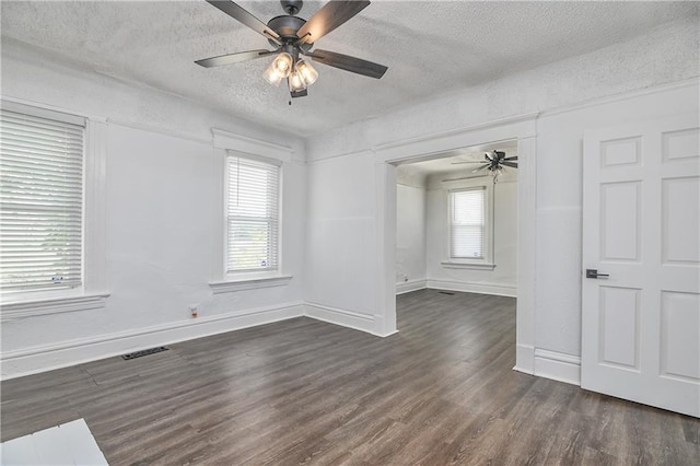 3229 Wayne Ave, Kansas City, MO 64109 - spare room featuring a textured ceiling, visible vents, baseboards, ceiling fan, and wood finished floors