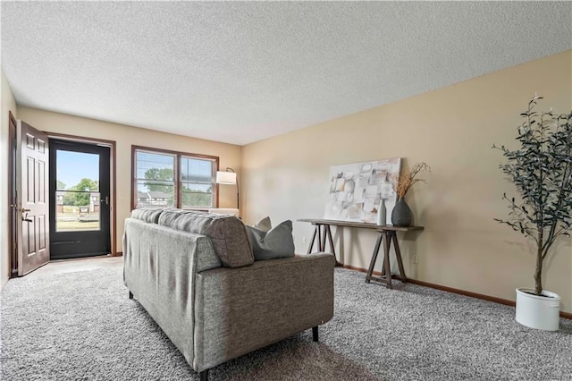 living room with a textured ceiling and carpet floors