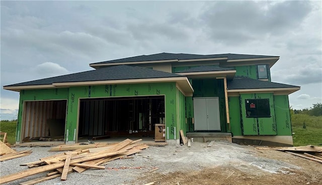 unfinished property with a garage