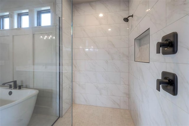 full bath with a freestanding tub and walk in shower