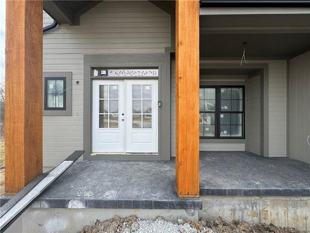 view of exterior entry featuring french doors