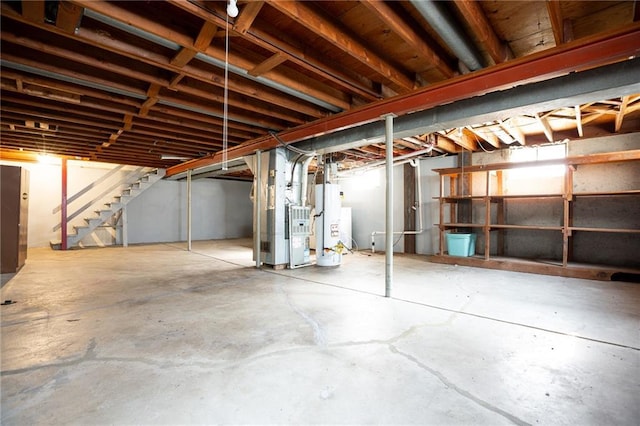 basement with water heater and heating unit