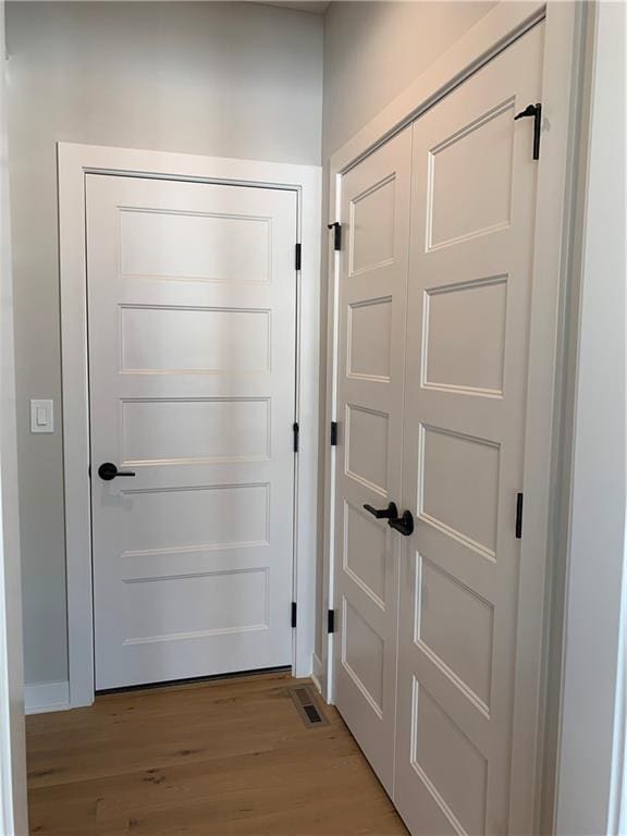 doorway with light wood-style flooring