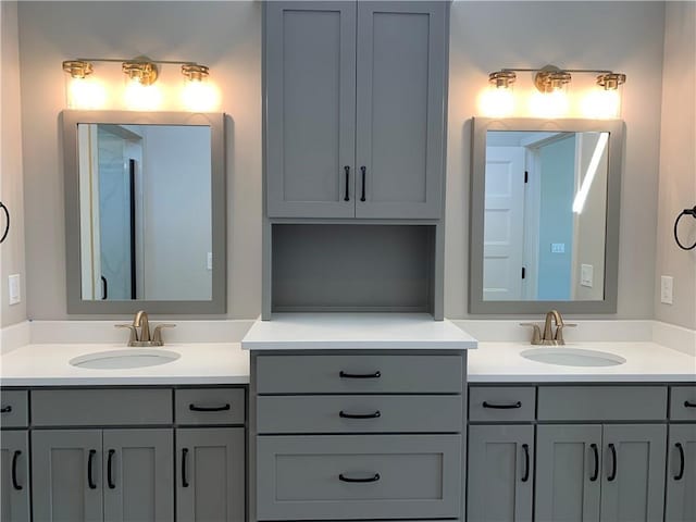 bathroom featuring double vanity and a sink