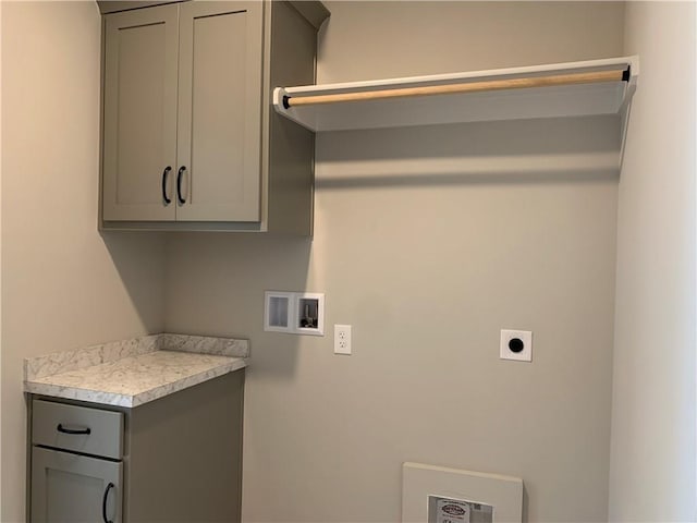 laundry room featuring hookup for a washing machine, cabinet space, and electric dryer hookup