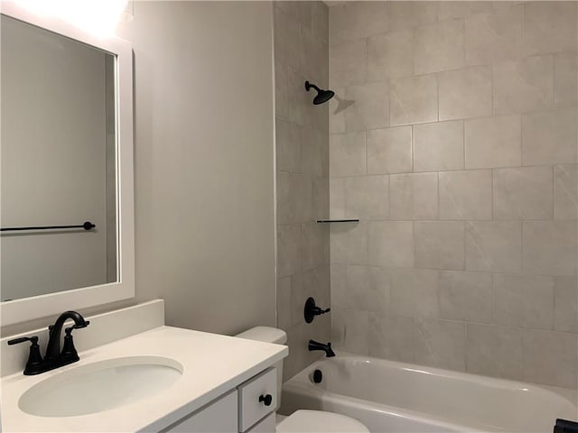 full bath featuring  shower combination, vanity, and toilet