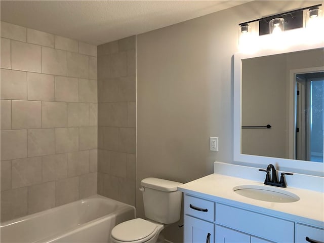 full bathroom with a textured ceiling, shower / bathtub combination, vanity, and toilet