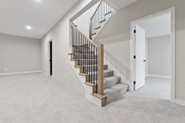 stairs with carpet flooring