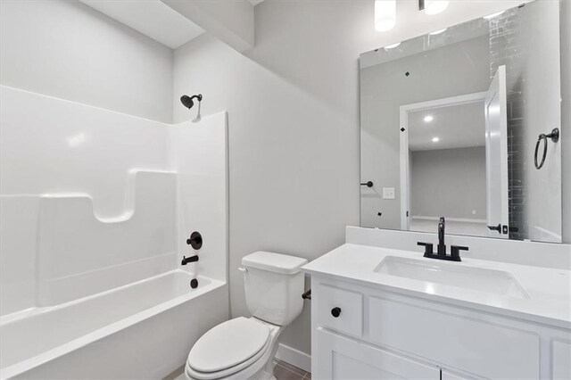 full bathroom with shower / bathing tub combination, vanity, and toilet