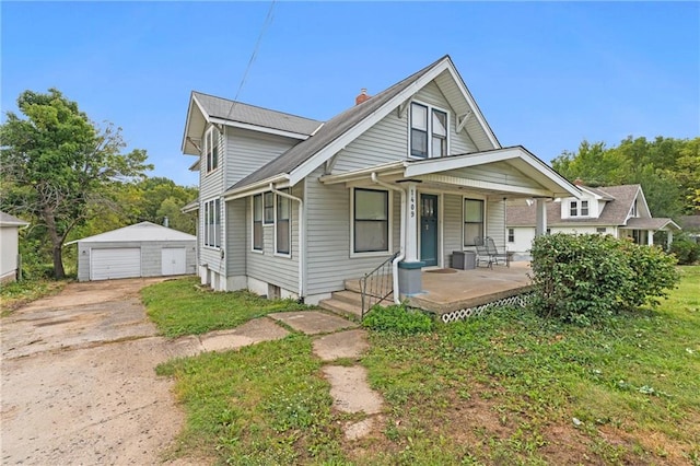 bungalow-style house with an outbuilding, covered porch, and a garage