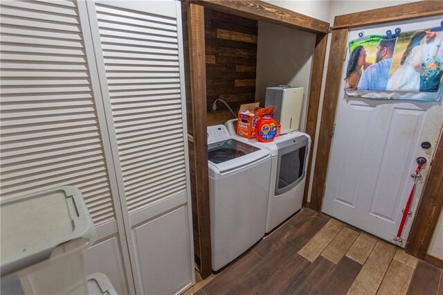 washroom featuring washer and dryer and dark hardwood / wood-style flooring