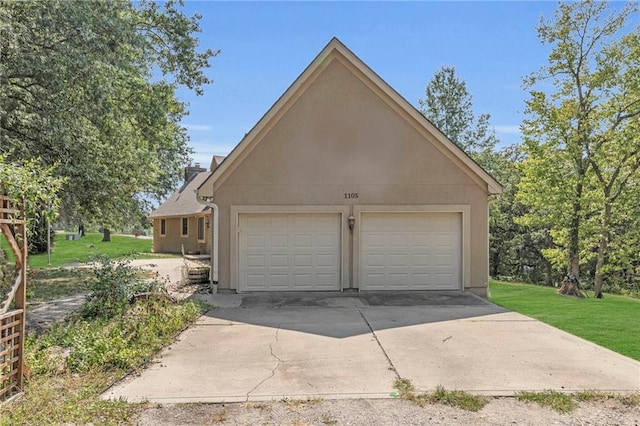 garage with a lawn