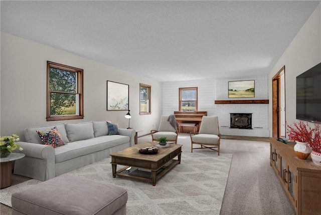 carpeted living room featuring a brick fireplace