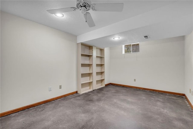 interior space featuring ceiling fan and a textured ceiling