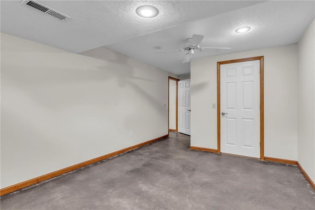 interior space with a textured ceiling and ceiling fan