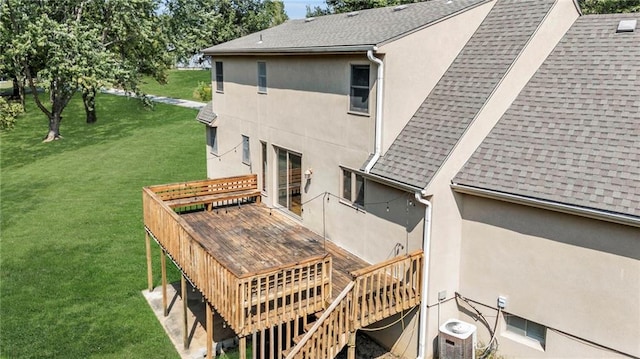 back of house featuring a deck, a lawn, and cooling unit