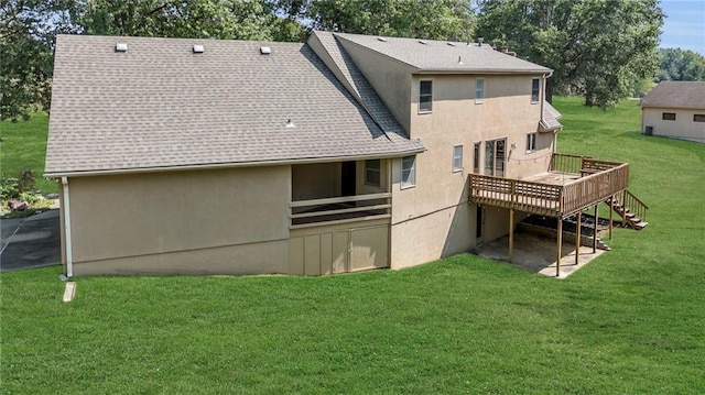 back of property featuring a wooden deck and a yard