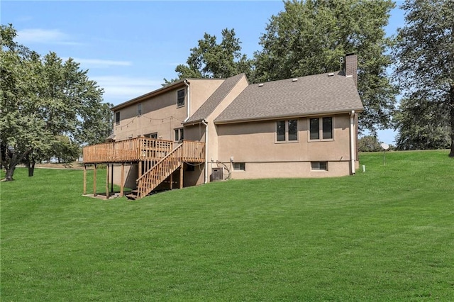 rear view of house featuring central AC, a yard, and a deck