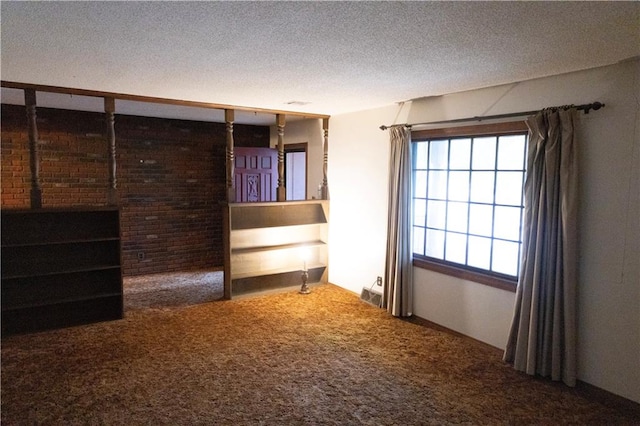 interior space featuring a textured ceiling and carpet