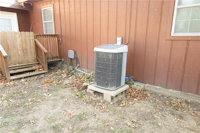 details featuring wood walls and central AC