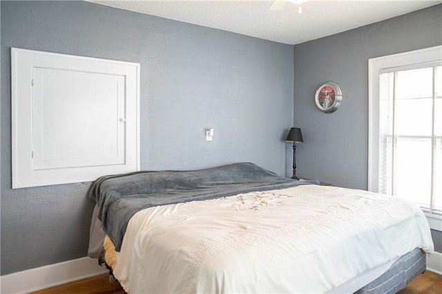 bedroom featuring ceiling fan and wood-type flooring