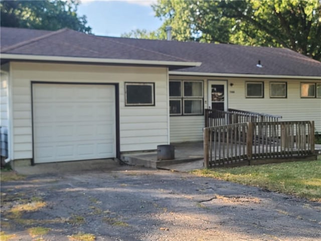 ranch-style home with a garage