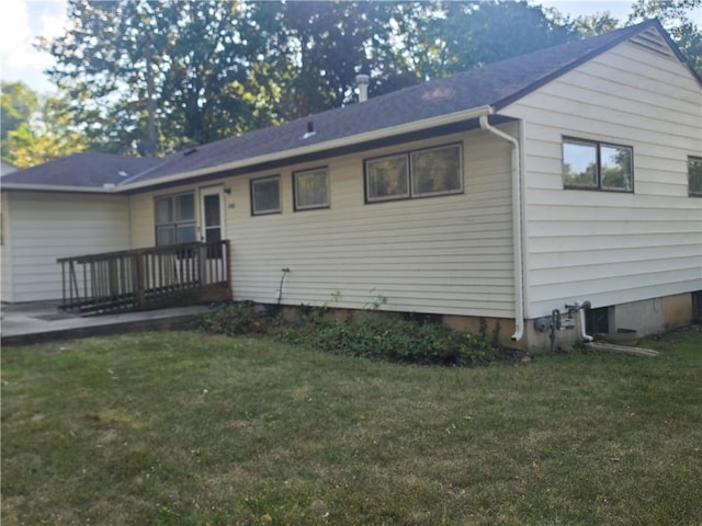 rear view of house with a lawn