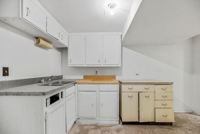 kitchen with white cabinets and sink