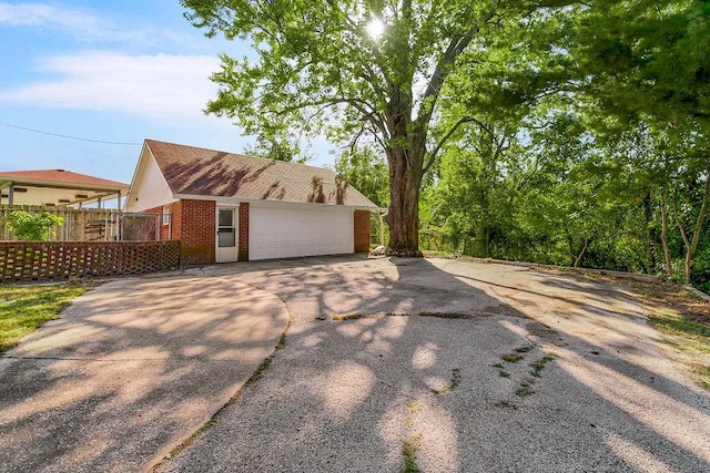 view of side of property with a garage