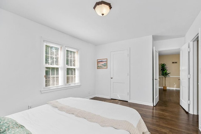 bedroom featuring dark hardwood / wood-style floors