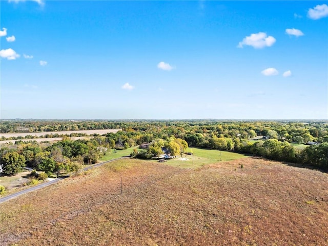 birds eye view of property with a rural view