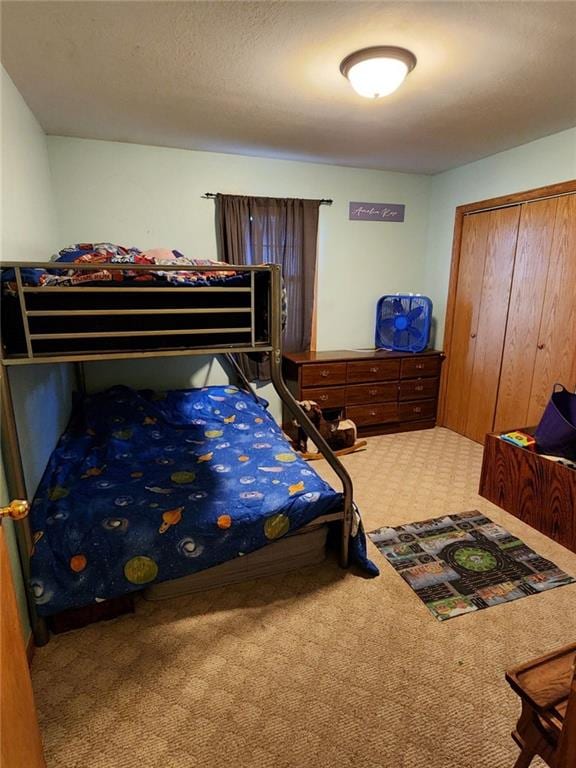 carpeted bedroom with a closet