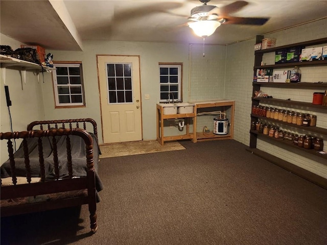 bedroom with ceiling fan and carpet floors