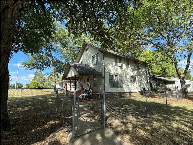 view of property exterior with cooling unit and covered porch