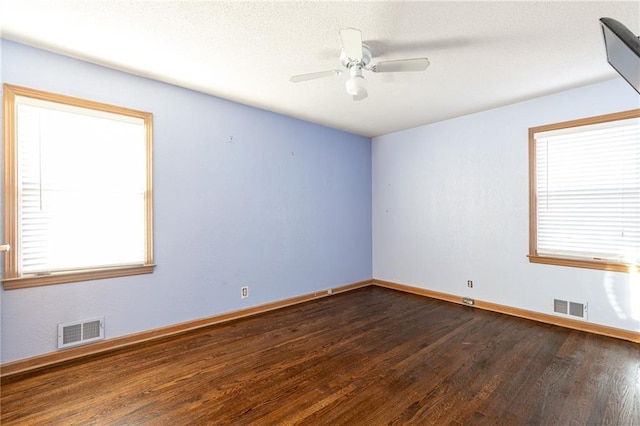 unfurnished room with ceiling fan, a textured ceiling, and hardwood / wood-style flooring