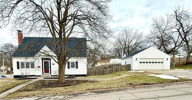 view of front of house with a garage and a front lawn