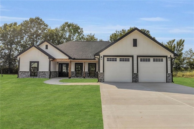 view of front facade featuring a garage and a front lawn