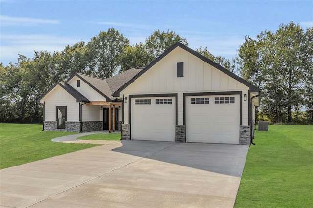 view of front of home with a front lawn, central AC unit, and a garage