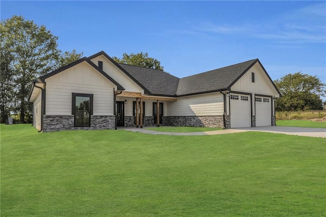 view of front of home featuring a garage and a front yard