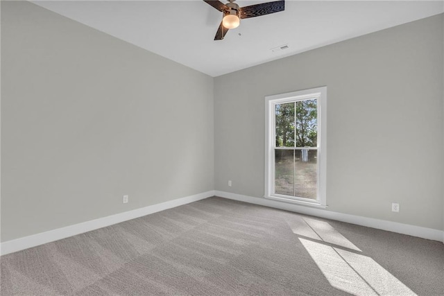 empty room with ceiling fan and carpet floors