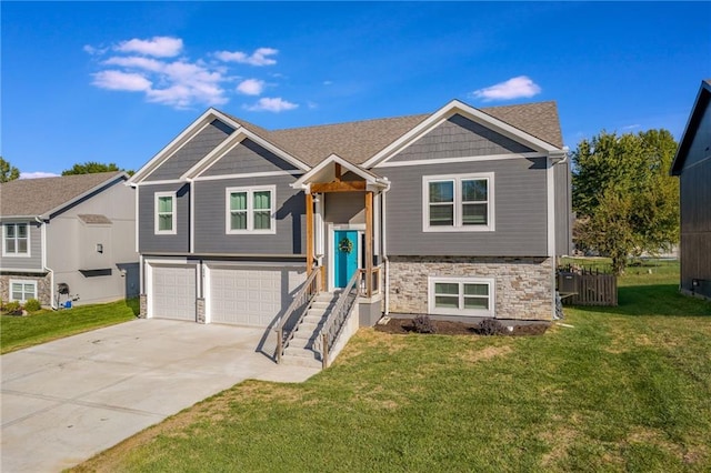 split foyer home with a front yard and a garage