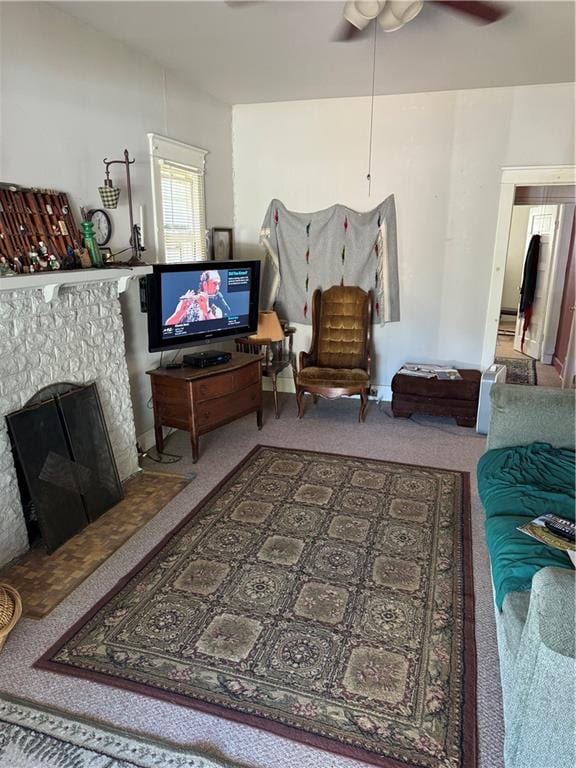 living room featuring carpet and ceiling fan