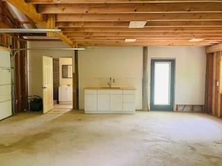 interior space with sink and fridge