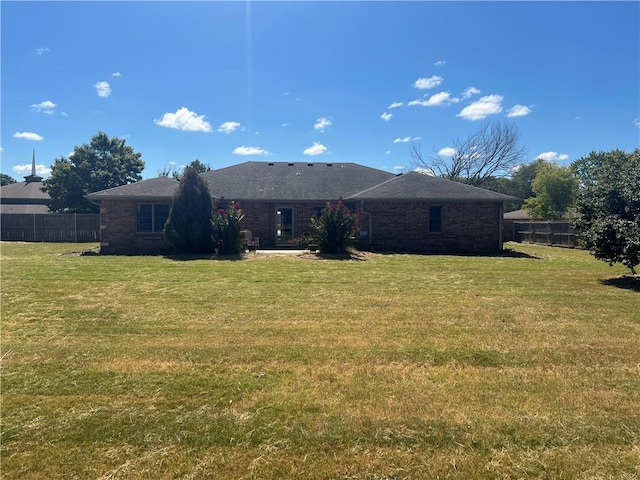 back of house with a yard