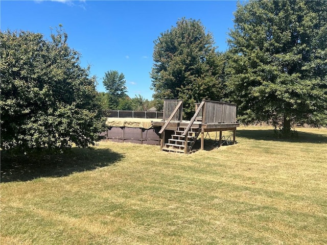 view of yard with a swimming pool side deck