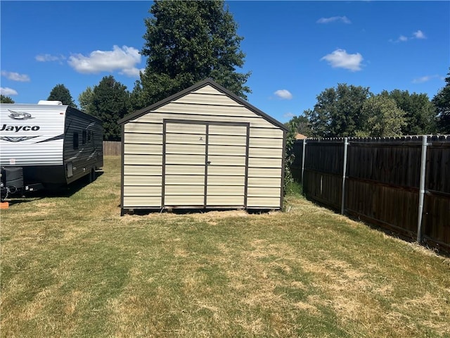 view of outdoor structure with a yard