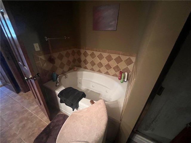 bathroom featuring plus walk in shower, vanity, and tile patterned floors