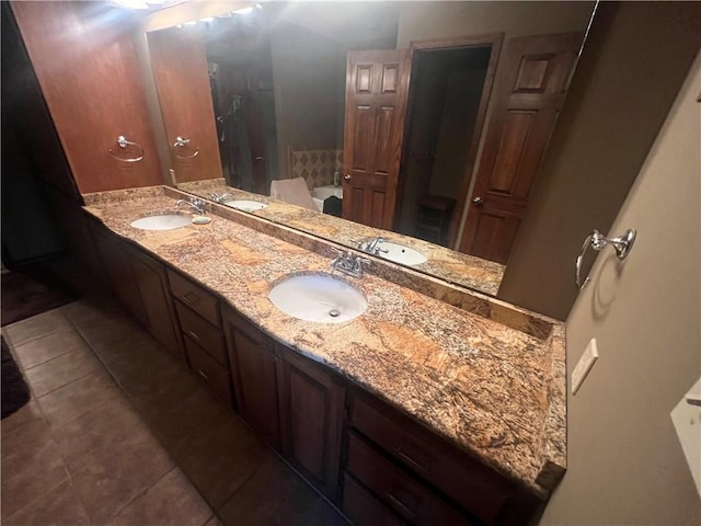 bathroom featuring vanity, a bathing tub, and tile patterned floors